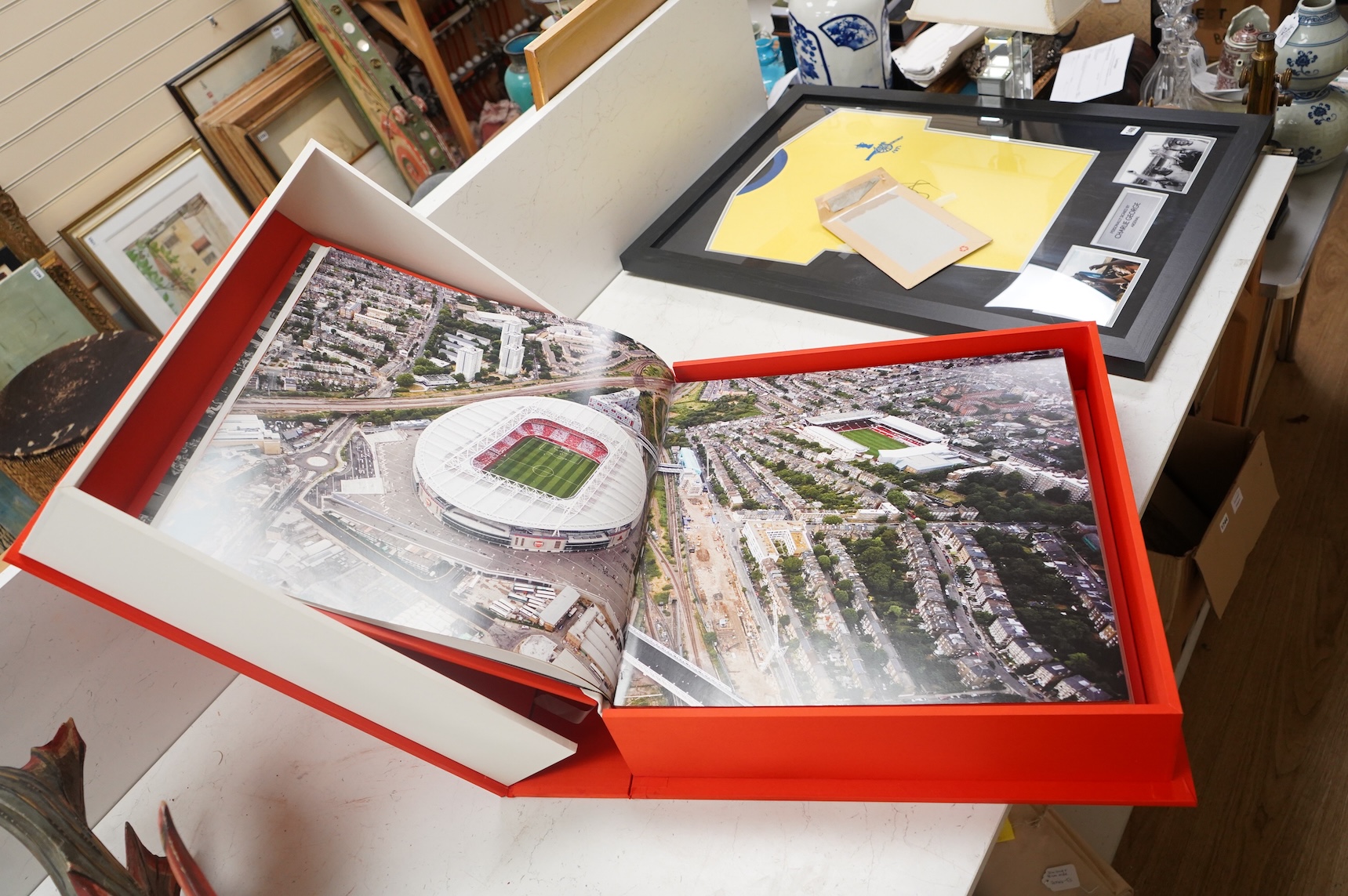 An Arsenal Opus, Icons Edition #47 in a series of 500, signed by Arsene Wenger, Tony Adams, Patrick Vieira, Dennis Bergkamp, Charlie George, Bob Wilson, Frank Mclintock, Thierry Henry, George Graham, Liam Brady, David Se